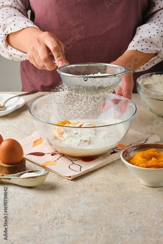 Wallpaper Mural Step by step preparation of yeast dough for pumpkin buns on a light concrete background. Step by step recipes. Recipes pumpkin, seasonal baking. Torontodigital.ca