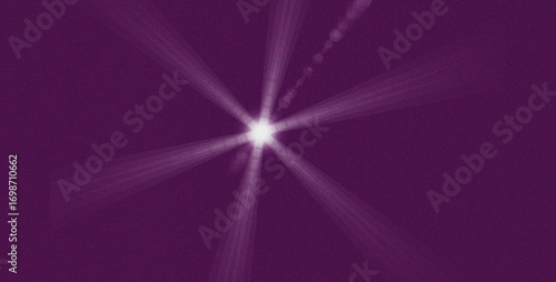 Abstract starburst of light emanating from a bright center against a deep purple textured background