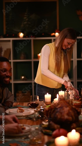 Woman serving thanksgiving turkey to friends