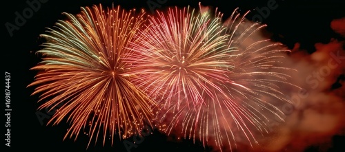 Colorful Fireworks Light up the Night Sky During a Celebration in a Festive A...