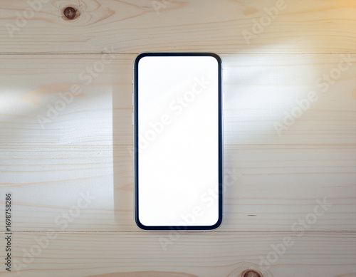 Smartphone Lying on Wooden Table with Blank White Screen – Top View Mockup