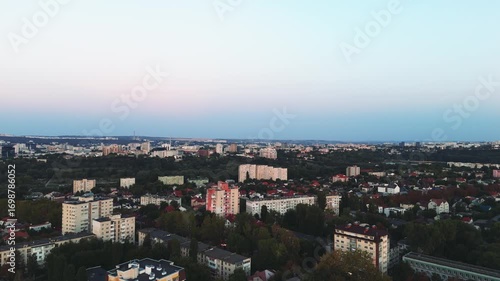 Chisinau city skyline at sunset, aerial drone view. Aerial sunset view of Chisinau city with soft evening light and colorful skyline.