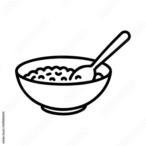 Bowl of delicious cereal or oatmeal breakfast with a spoon ready to eat