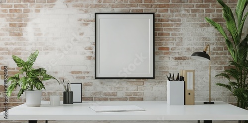 White Office Desk With Picture Frame Hanging on Brick Wall During Daytime