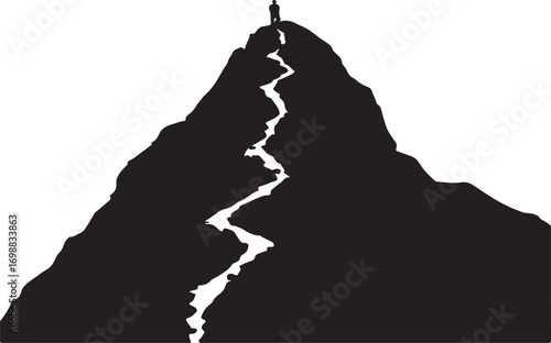Silhouette of person standing on mountain peak with winding path