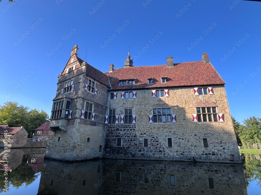 Naklejka premium Castle on water Fischering, Ludinghausen, North Rhine Westphalia, Germany