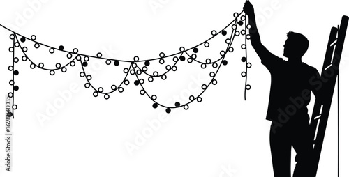 Silhouette of man decorating complex string lights while standing on ladder for festive event, holiday celebration or party preparation.