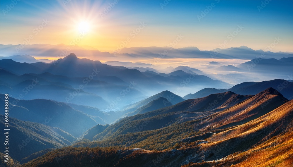 Obraz premium mountain range and sunlight in hazy landscape