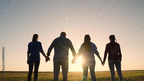 Teamwork of people raising their hands to sky, family business team concept. Group of people holding hands raise their hands to sky, prayer of man of woman. Business people, partners, trust concept