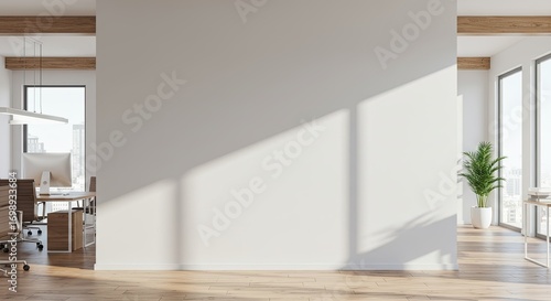 Wallpaper Mural A bright, modern office interior featuring a large blank white wall illuminated by natural sunlight, with glimpses of workspaces and plants on either side. Torontodigital.ca