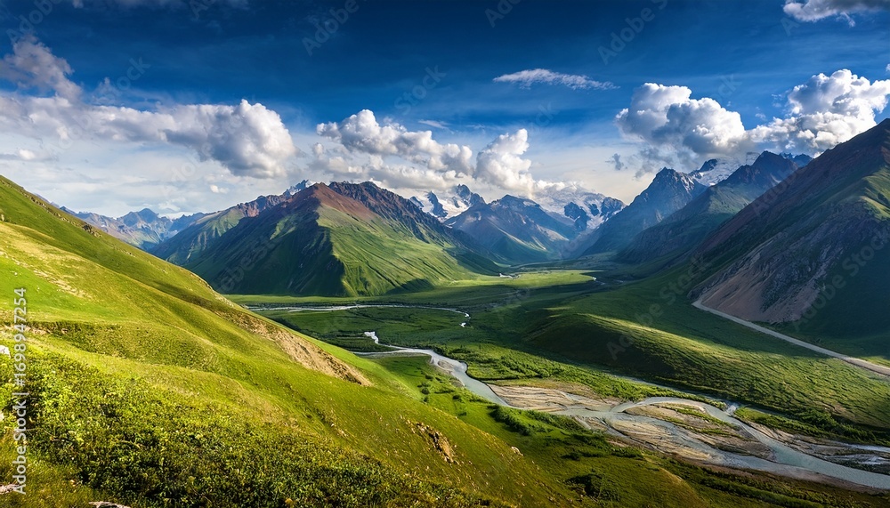 Fototapeta premium a mountain range with a blue sky and clouds the mountains are covered in green grass and there is a river in the distance the sky is filled with clouds giving the scene a peaceful