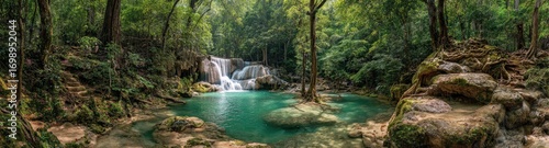 Lush tropical waterfall cascading into a turquoise pool, surrounded by dense jungle foliage
