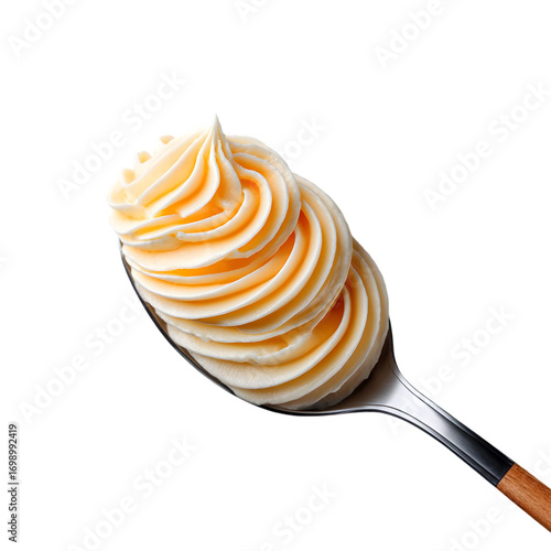 spoonful of cream cheese frosting with smooth texture and swirls