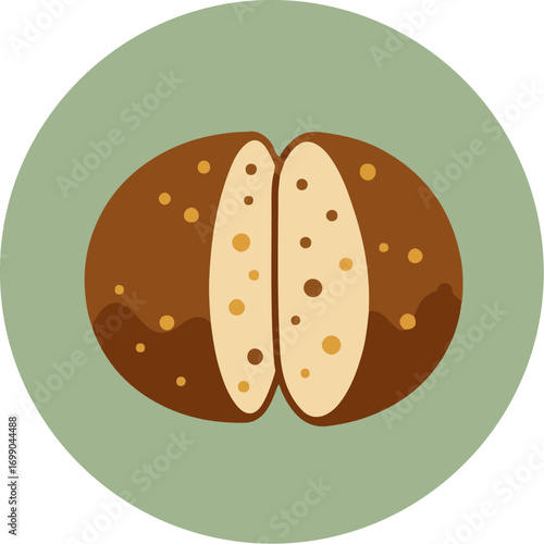 Close-up view of a bisected coffee bean with rich dark brown shell and creamy interior on a soft green background
