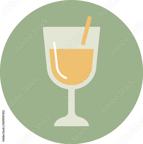 Sleek cocktail glass with light orange beverage on soft green background