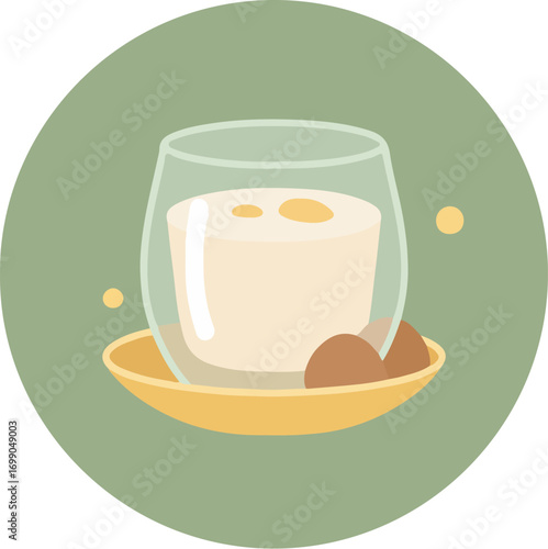 Glass of milk on yellow saucer with chocolate cookies on green background