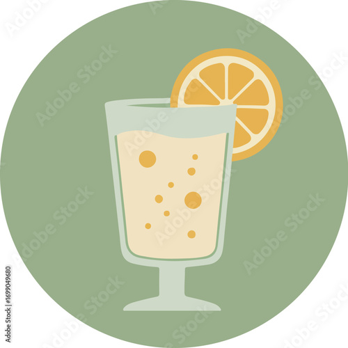 Tall glass of sparkling citrus beverage with orange slice on green background