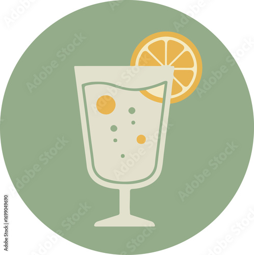 Tall clear glass with light-colored cocktail and orange slice on green background