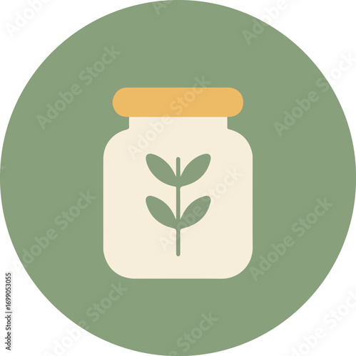 Transparent glass jar with orange lid containing a green plant on a light green circular background