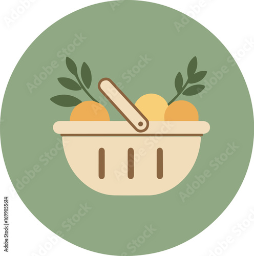 White wicker basket with bright orange fruits and green leaves on a muted green background