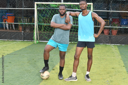 two african Soccer players having fun after friendly match on soccer field