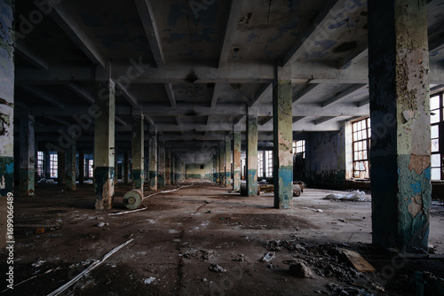 Large empty abandoned industrial hall at night