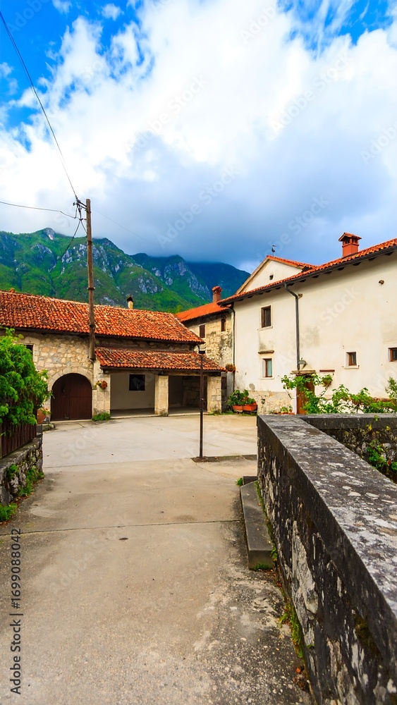 Obraz premium Picturesque village square under a partly cloudy sky