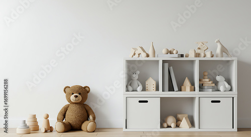 Teddy bear sitting next to a white shelf with toys and books.