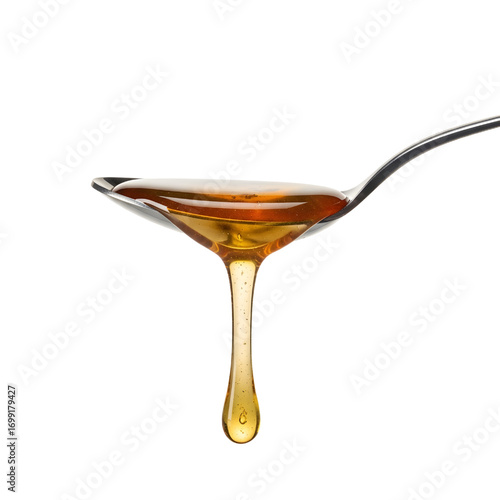 Honey dripping from spoon isolated on white background