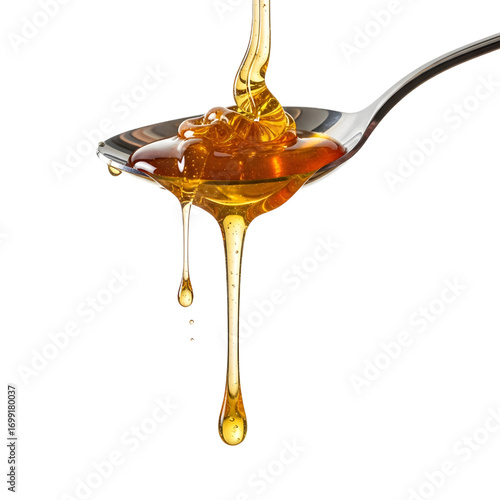 Honey dripping from spoon isolated on white background