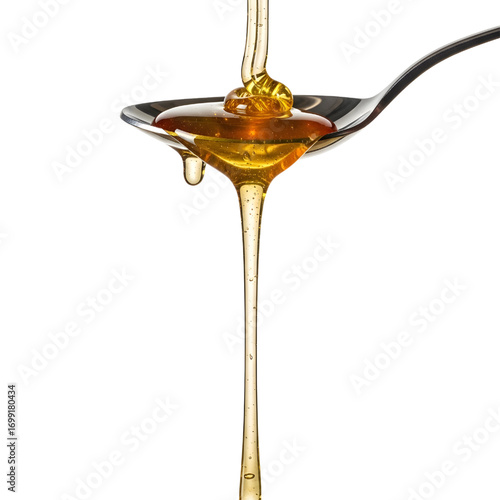 Honey dripping from spoon isolated on white background