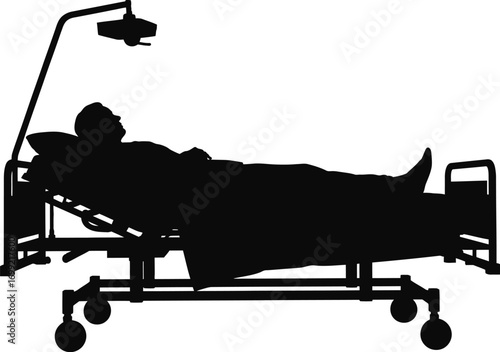 Patient lying in hospital bed with overhead lamp silhouette