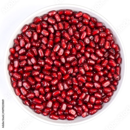 Pomegranate seeds in a white bowl