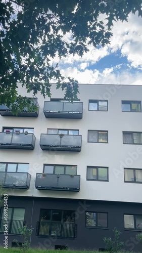 Urban architecture and modern residential infrastructure. Facade of a multi-storey apartment building. Real estate.