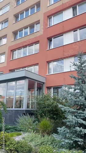 Vertical view of urban architecture and modern residential infrastructure. Facade of a multi-storey apartment building. Real estate.