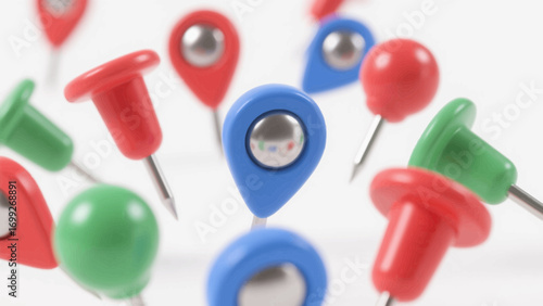 Close up of colorful push pins and map tacks on white background studio shot