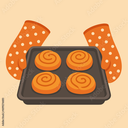Baking delight: fresh cinnamon rolls in polka dot oven mitts