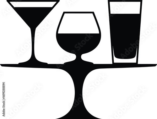 Silhouette of three different cocktail glasses on a tray