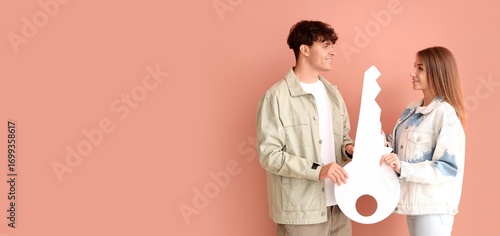 Young couple with big paper...