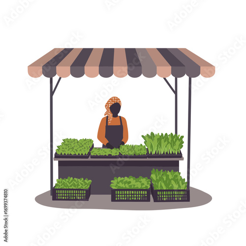 A vendor stands behind a market stall showcasing fresh, vibrant green plants for sale.