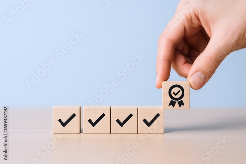 Hand Completing Checklist with Wooden Blocks: Quality Assurance and Compliance Concept