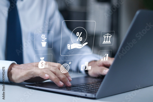 Investment concept, Lending, mortgage, loan interest rate, financial credit, economy growth, income tax calculation, debt and financial credit. Businessman use laptop with virtual icon.