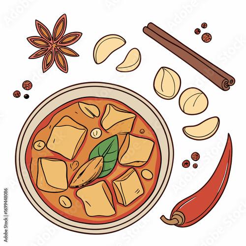 A delicious bowl of tofu curry surrounded by aromatic spices and ingredients