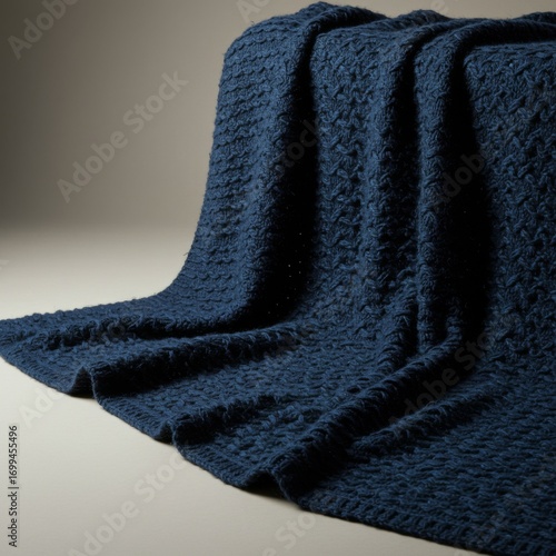 Navy Blue Chunky Knit Throw Blanket on Neutral Background