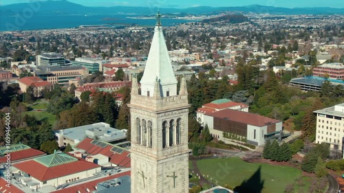 Aerial view of UC Berkeley's iconic Campanile clock tower and campus buildings, showcasing the university's architecture and urban setting in California, USA.