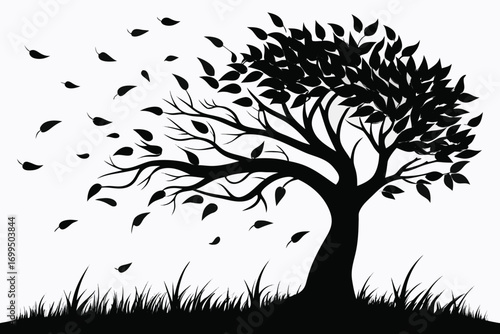 Silhouette of a tree with leaves blowing in the wind
