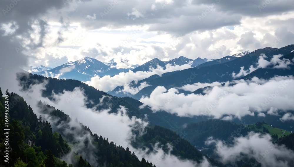 Fototapeta premium Mountain range shrouded in clouds