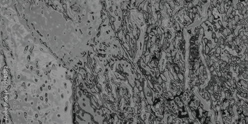 Abstract grey artwork with fluid organic shapes and textured layered details creating a visual surface for backgrounds and creative designs