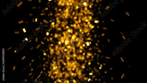 Golden confetti showering against a dark background, capturing a moment of celebration.