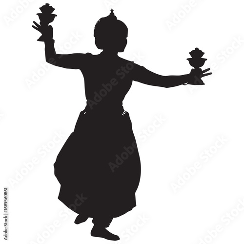 Silhouette of a dancer in traditional indian attire holding lotus flowers